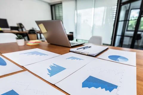 Close up fo Business document on working table with laptop and business chart Stock Photos