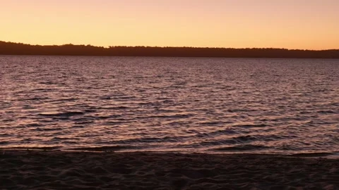 Close up fo water as sunsets over lake Stock Footage 305522877