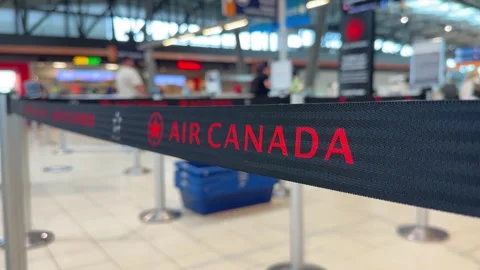 Close-up focus on black Air Canada stanchion queue belt line Video stock 342578383