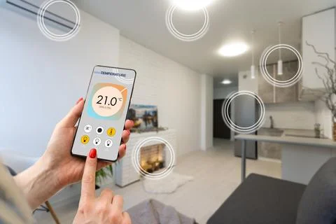 Close up focus on cellphone with smart home software application on screen 写真素材