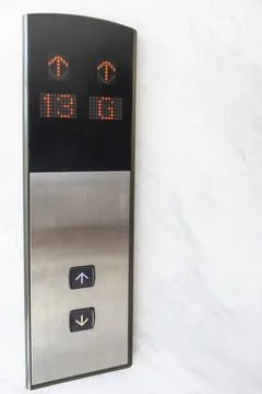 Close-up focus of the elevator up and down buttons and floor numbers Stockfoto's