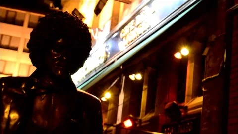 Close up Focus Movement Face of Phil Lynott Statue at night in Dublin, Ireland Stock Footage 77839110