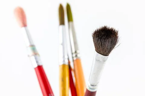 Close focus on paintbrushes on white background. Stock Photos