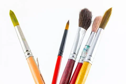 Close focus on paintbrushes on white background. Stock Photos