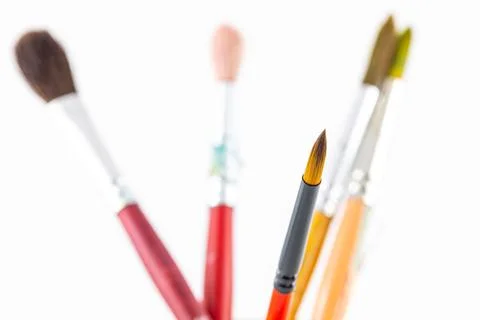 Close focus on paintbrushes on white background. Stock Photos