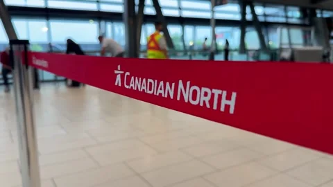 Close-up focus on red Canadian North stanchion queue belt barrier Video stock 342578384