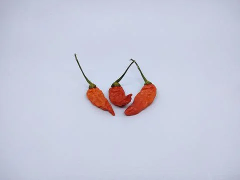 Close-up focus of selective red chilies, isolated on white background Stock Photos