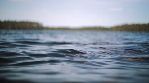 Close up focus shot of waves in lake Stock Footage 95272426
