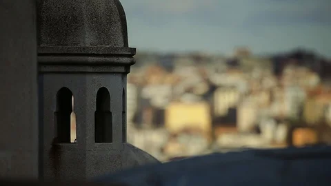 Close up focus on stoned ancient tower, focus moves on beautiful cityscape under 스톡 동영상 105275172