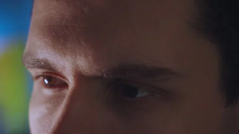 Close-up of focused eyes while working at a computer Vídeo Stock 327273575