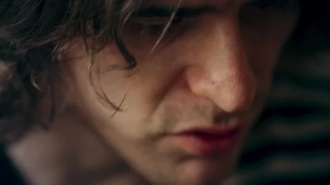 Close-up of the focused face of a freelancer working at a computer. A Stock Footage 264060560