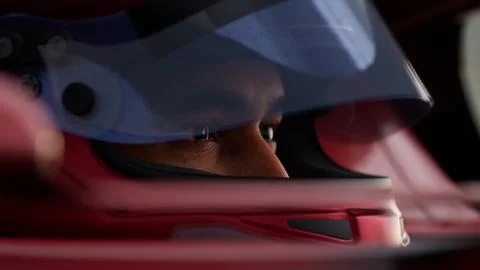 Close-up of a focused pilot driver in a red racing car, preparing for a race Stock Illustration