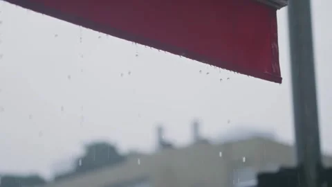 Close up on foldable roof or canopy during cold rainy day as drops drip down Stock Footage 293705920