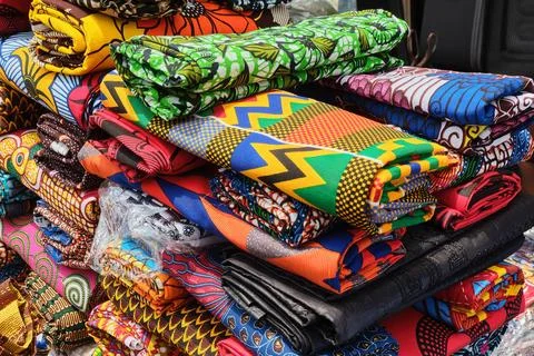 Close up of folded brightly multi coloured and patterned African Stock Photos