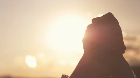 Close-up of folded hands of sucessful man against the sun Stock Footage 66792747