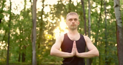 Close up of folded palms men portrait meditate in park in morning. Yoga practice Video stock 156523610