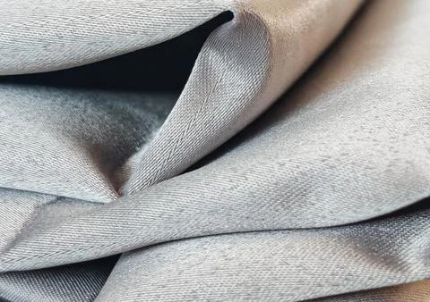 Close-up folded textile fabric texture with soft neutral tones and detailed  Stock Photos
