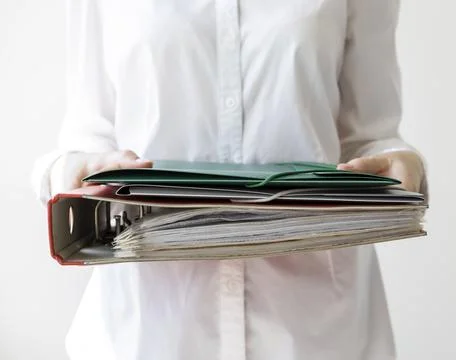 Close-up, folders for documents in the hands of a woman 스톡 사진