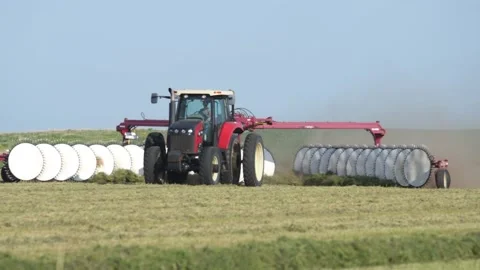 Close Follow of Tractor and Rake Stock Footage 221861862