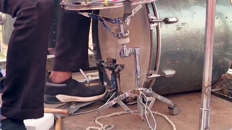 Close-up of foot operating drum pedal in outdoor percussion performance Stock Footage 333230041