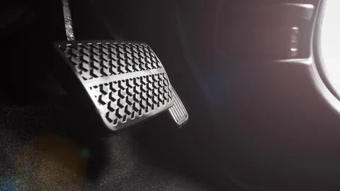 Close up foot press or push foot break and accelerate pedal of a car to dri.. Foto stock