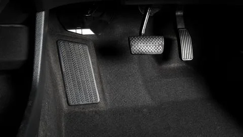 Close up foot press or push foot break and accelerate pedal of a car to dri.. Stock Photos