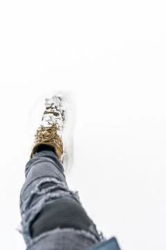 Close up of a foot in the snow. Stock Photos