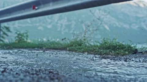 Close-up of a foot stepping into a puddle. Bottom view of a girl running in the Stock Footage 223246185