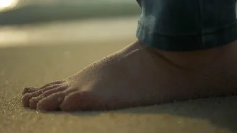Close up of a foot walking on the sand next to the blue amazing ocean Stock Footage 170707773