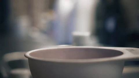 Close-up footage of adding and mixturing cosmetic products into a plastic bowl Stock Footage 86685752