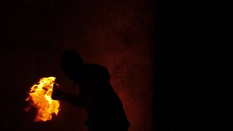 Close footage of anonymous protester throw burning Molotov's cocktail 스톡 동영상 144669865