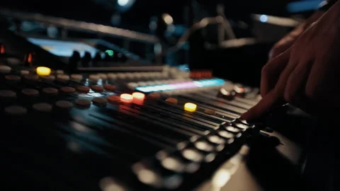 Close up footage of audio mixer knobs being pulled up and down by a man Stock Footage 89869035