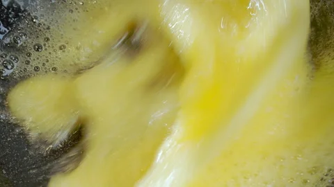 Close-up footage, beating eggs and sugar to make a sweet dish. Stock Footage 274463497