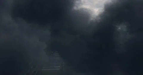 Close up Footage of Black Dense Clouds of Smoke Rising into the Air from the Video stock 135407627