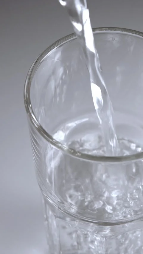 Close-up footage of a clear empty glass being filled with clean fresh water.. Stock Footage 342216212