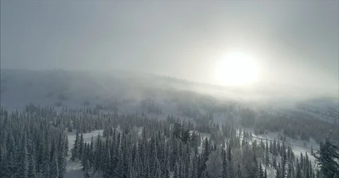 Close-up footage of clouds passing over high mountains covered with snow Stock Footage 119470797