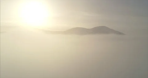 Close-up footage of clouds passing over high mountains covered with snow Stock Footage 119470834