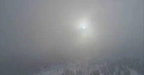 Close-up footage of clouds passing over high mountains covered with snow Stock Footage 119470881