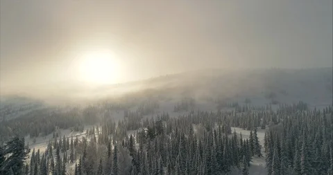 Close-up footage of clouds passing over high mountains covered with snow Stock Footage 119470922