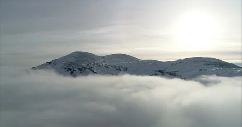 Close-up footage of clouds passing over high mountains covered with snow Stock Footage 119471007