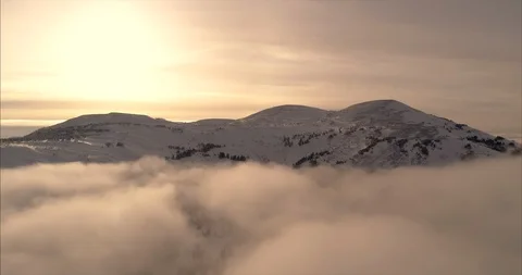 Close-up footage of clouds passing over high mountains covered with snow Stock Footage 119471233