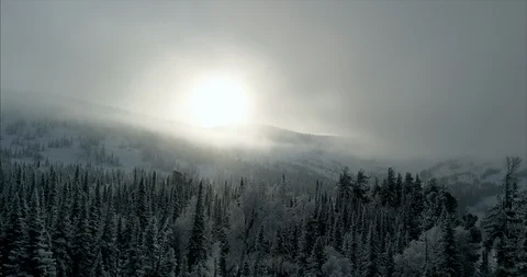 Close-up footage of clouds passing over high mountains covered with snow Stock Footage 119471414