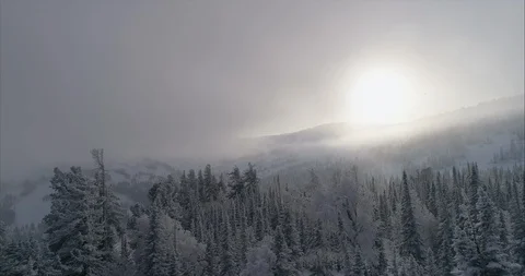 Close-up footage of clouds passing over high mountains covered with snow Stock Footage 119471459
