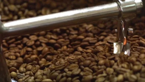 Close up footage of coffee processing with beans mixing and roasting in special Stock Footage 84259613