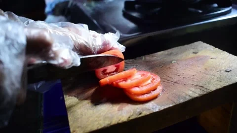 Close-up footage of cutting tomatoes Stock Footage 273166804