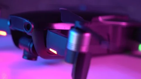 Close up footage of drone turn on table and lift up camera. Stock Footage 124928243