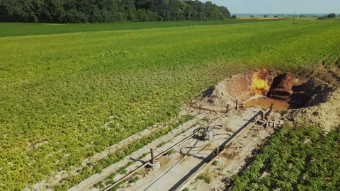 Close-up footage of gas installation. Fire burning in pit. Metal supports Stock Footage 219953673