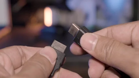 Close-up Footage of Hand Holding HDMI Cable End 库存影片 252240505