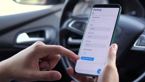 Close-up footage of hands in a car using a parking reservation app, carefully Stock Footage 315029929