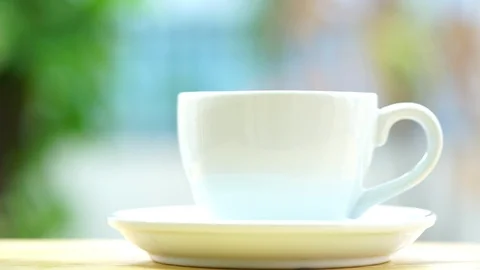 Close-up footage macro. hot black coffee in glass pouring into cup of coffee Stock Footage 122371812